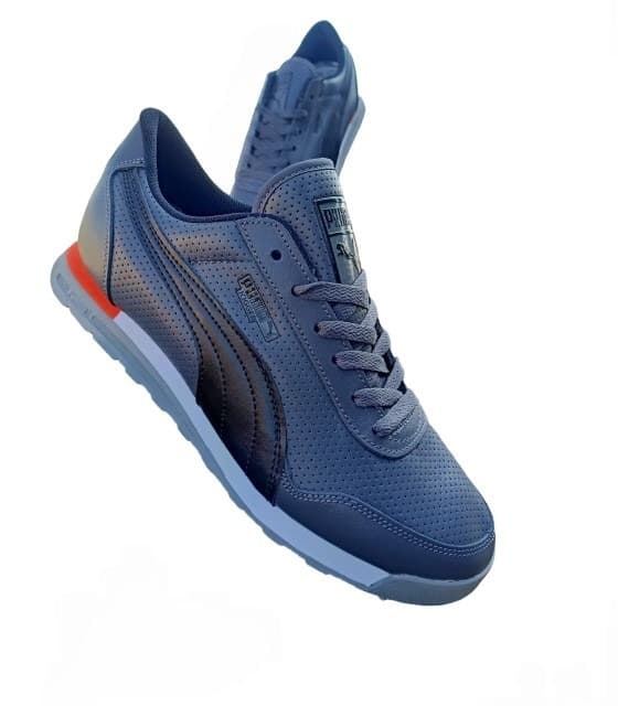 Puma leather jogger shoe Crafted from high-quality synthetic leather for a sleek, durable finish that combines timeless style with modern comfort and easy maintenance.